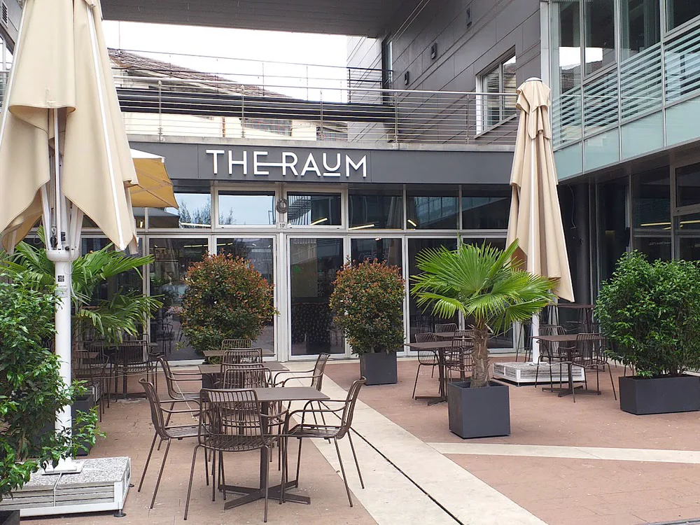 The Raum's terrace and sign, seen from the courtyard